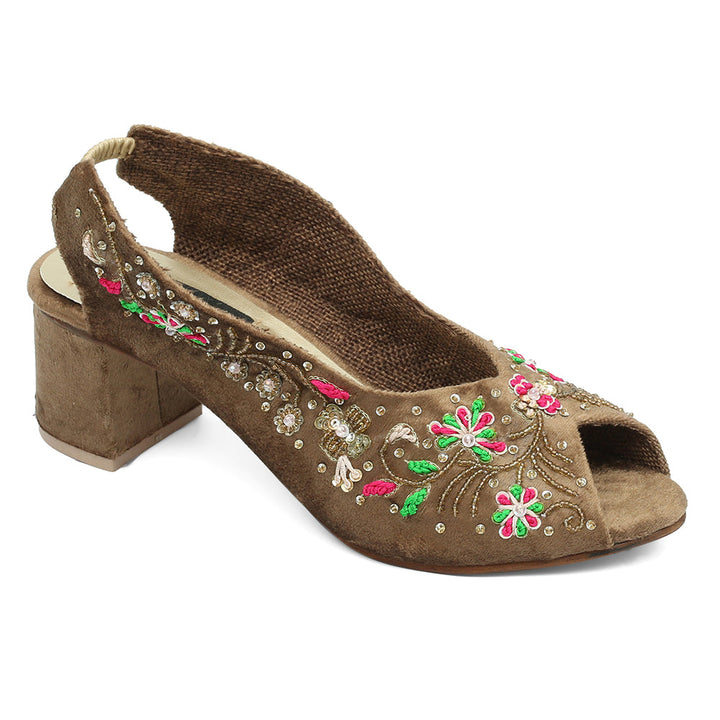 A brown open-toe platform wedge heel shoe with floral embroidery detailing and a ankle strap.