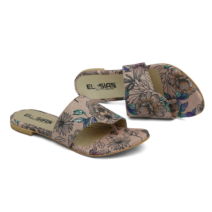 A pair of beige floral-printed slippers with the brand name 'Elysian' visible on the strap.