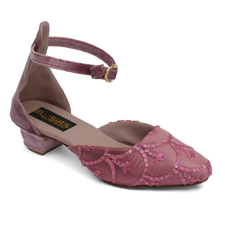 A pink sandal with a back strap and intricate embroidery, featuring a brand label on the sole.